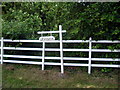 Sign and woods at Woodleys