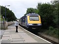 Intercity train stops at rural Kilgetty station