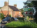 TG2238 : Cottages  near A140 - A149 junction by Zorba the Geek