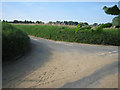 Sandy road junction near Vale Farm