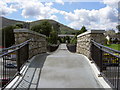 O2414 : View of the footbridge at Kilmacanoge by David Quinn