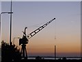 Small crane in Pre Dawn on the ship canal