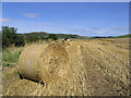 NU0110 : Bale and stubble field by Walter Baxter