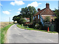 East past cottages near Bodham Common