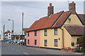 Cottages next to car dealership / garage