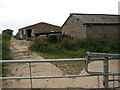 Farm road past sheds belonging to Grove Farm