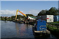 Transferring dredgings from hopper to truck at Appley Bridge