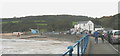 The Benllech seafront at high tide on a cold and grey September day