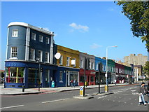 TQ3178 : Brightly Coloured Shops at Kennington Cross by Danny P Robinson