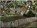 Bledington: wall and cottage