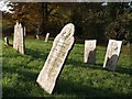 SX3590 : Gravestones, St Giles on the Heath church by Derek Harper