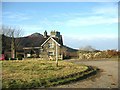 House and lay-by alongside the A499