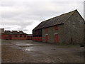 Stone barn and brick buildings at Trehelig Farm