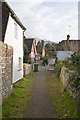 Footpath from the church emerges onto the A32, West Meon