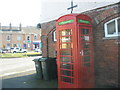 Looking past the phonebox towards the post office