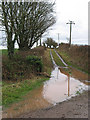 Muddy track to the trig point