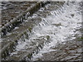 Water overflowing from Clow Bridge Reservoir