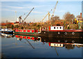 Houseboats reflected in the Sheffield and South Yorkshire Navigation