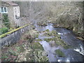 Looking down in to river from bridge to railway station