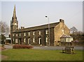 Houses and church spire, Main Street, Burley in Wharfedale