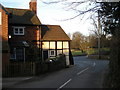 Cottage at the junction with the A458.