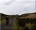 NS2574 : Two motor bikes climbing the hill towards Loch Thom by Elliott Simpson