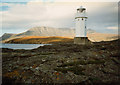 NH0997 : Rubha Cadail lighthouse and Ben More Coigach by Peter Bond