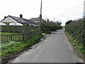 Houses on the E side of Alland Grange Lane