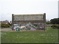 Mysterious graffiti  covered building near the seafront