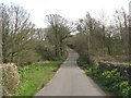 Country lane climbing up towards the crossroads at Llanallgo