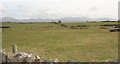 SH4559 : View inland across farmland with the Nantlle Hills in the background by Eric Jones