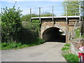 Farm road off Parish Road passes under the railway