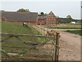 SJ6631 : Barn conversions at Old Colehurst Manor by John M