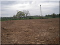 Ploughed field across the path to Wood End Farm