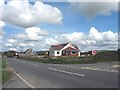 New bungalow under construction alongside the B4422 at Capel Mawr