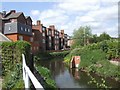 River Stour flowing behind properties in Mill Street