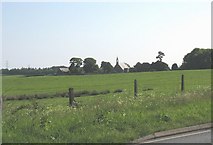 SH5767 : The Pentir parish church and mortuary chapel seen from the A4244 by Eric Jones