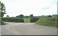 A road junction and a sharp bend on the approach to the A55 overbridge