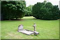 Solitary grave stone in a park