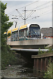 SK5543 : Tram crossing the River Leen by Alan Murray-Rust