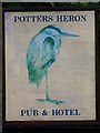 Sign for the Potters Heron Hotel