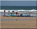 Surfing instruction on Fistral Beach