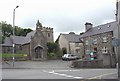 The Church of St Mary, the lych gate and the old rectory viewed across the town square