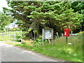 Postbox and information board.