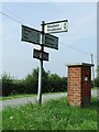 Postbox and direction sign