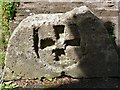 Cross carved in stone. St Budeaux Church, Plymouth.