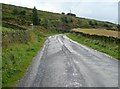 A wet road, Hill House Road, Cartworth