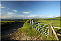 Minor road and field gate south of Newtown, Wales