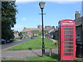 Bamburgh telephone box, with castle in background