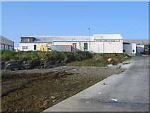 HY4448 : Looking up Gill Pier towards Westray Processors Ltd by Nick Mutton 01329 000000